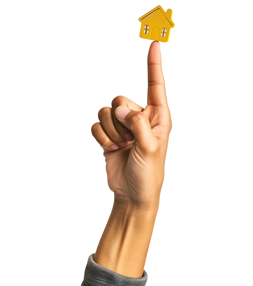 Main pointant une maison